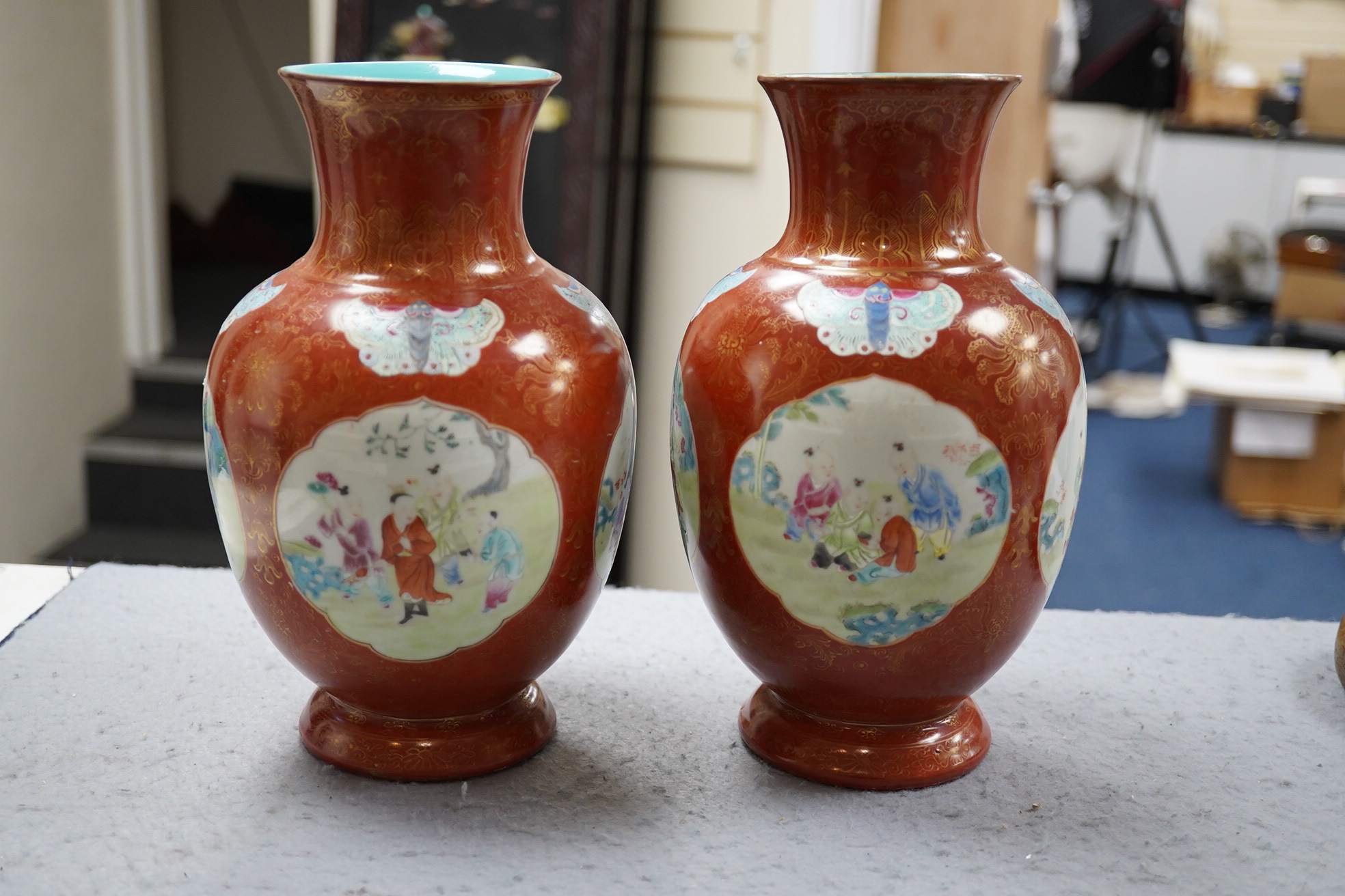 A pair of Chinese coral ground ‘boys’ vases, Jiaqing period (1796-1820)